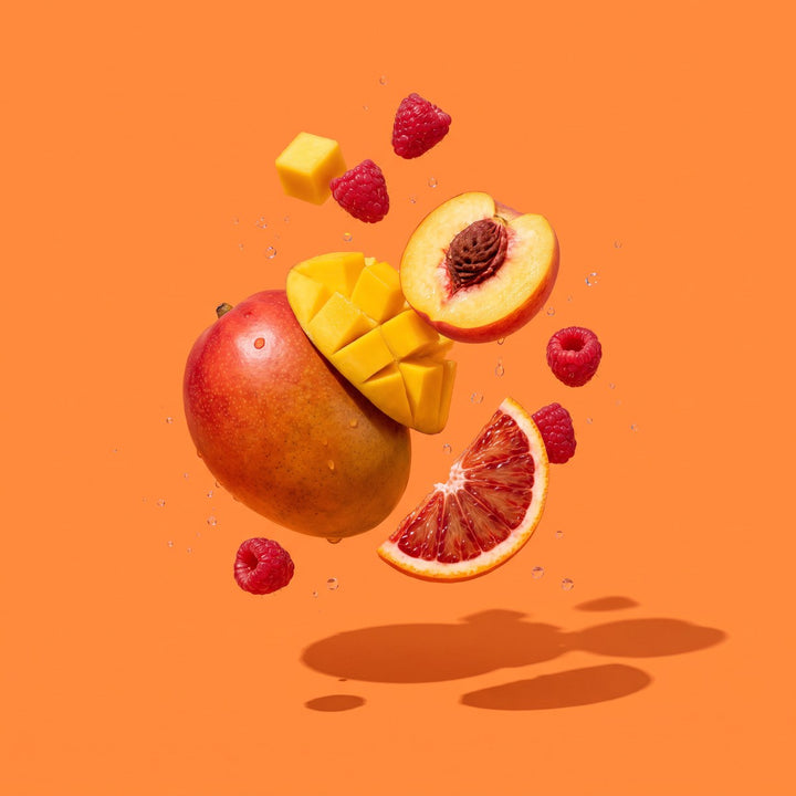 Frische Früchte auf orangem Grund